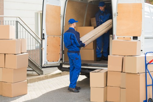 Packing boxes and wrapping fragile household items in Colliers Wood