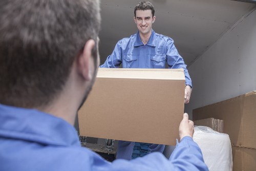 Careful carrying of student furniture from a Colliers Wood property