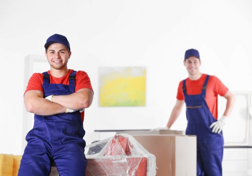 Furniture removals team handling household items in Colliers Wood