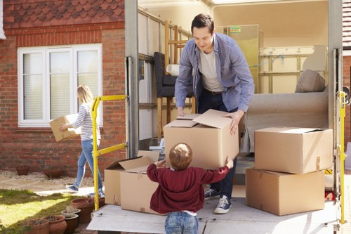 Packed boxes and furniture ready for transport in Colliers Wood