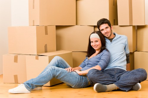 Local movers preparing boxes and furniture for transport